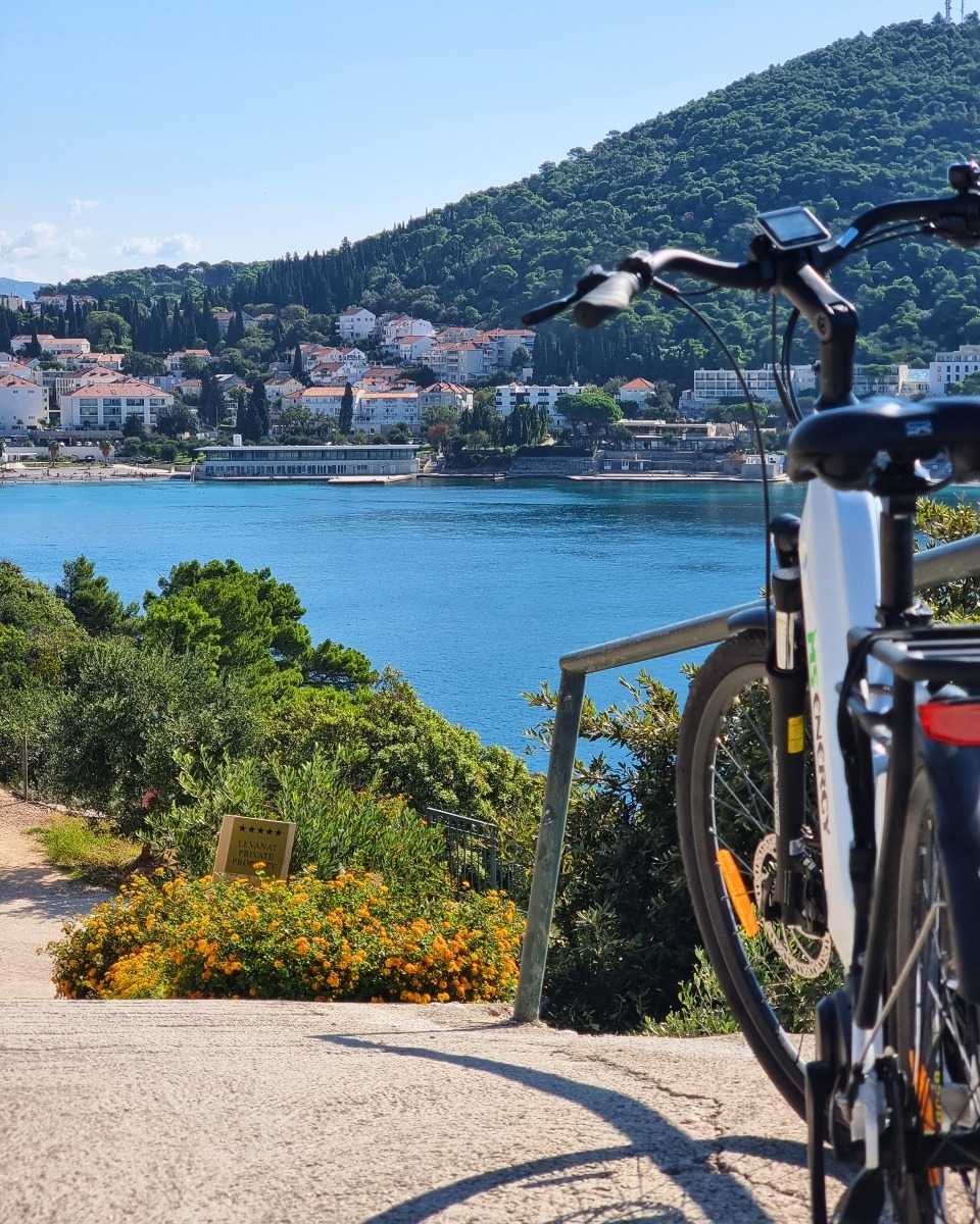 E-bike parked at a coastal viewpoint overlooking Lapad Bay in Dubrovnik.